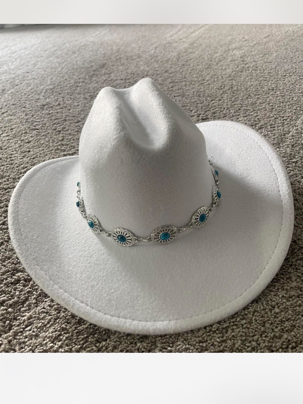 White and turquoise western hat